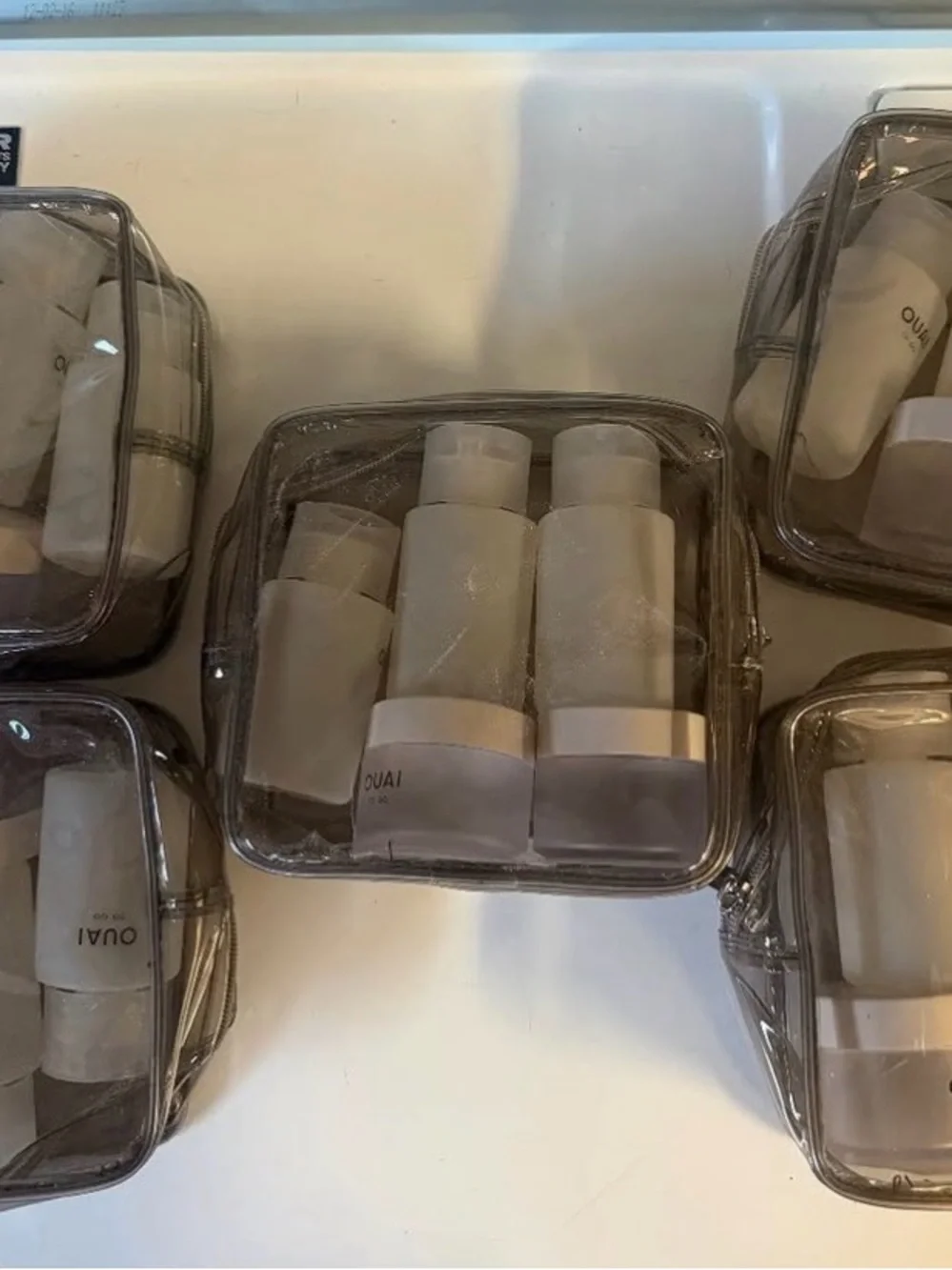 OUAI TO GO REFILLABLE TRAVEL BOTTLE KIT (empty)